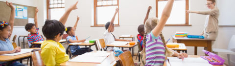 Children With Raised Hands In Classroom 1
