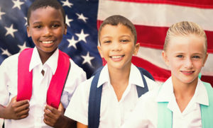 K-12 Students Standing with US Flag