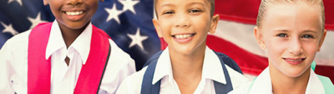 K-12 Students Standing with US Flag